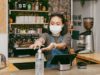 retail-staff-sanitizing-her-hands